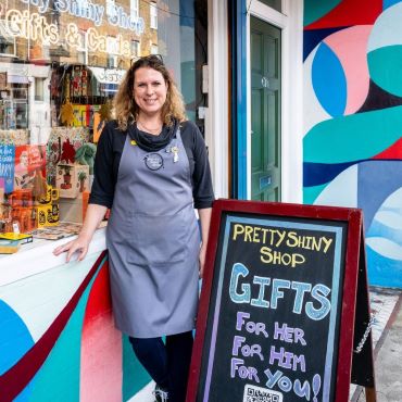 The owner outside Pretty Shiny Shop's shopfront 